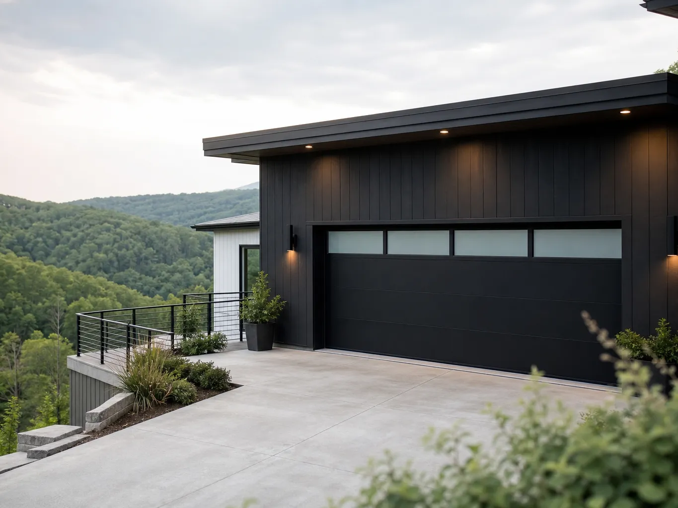 Modern hillside home with a black flush panel garage door and a row of frosted windows